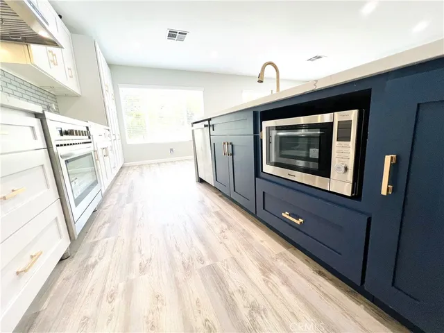 a hallway with a large stove top oven