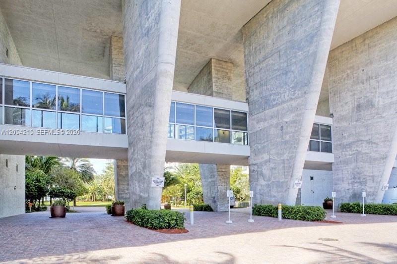 1500 Bay Road, Unit 1172S Miami Beach, FL 33139 - Photo 4 of 15 a front view of a building with a garden