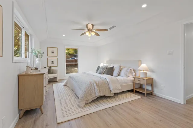 a bathroom with a double vanity sink toilet mirror and shower