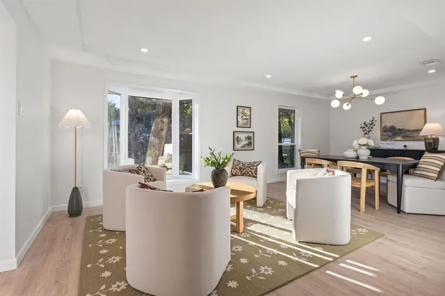 a living room with furniture and a table