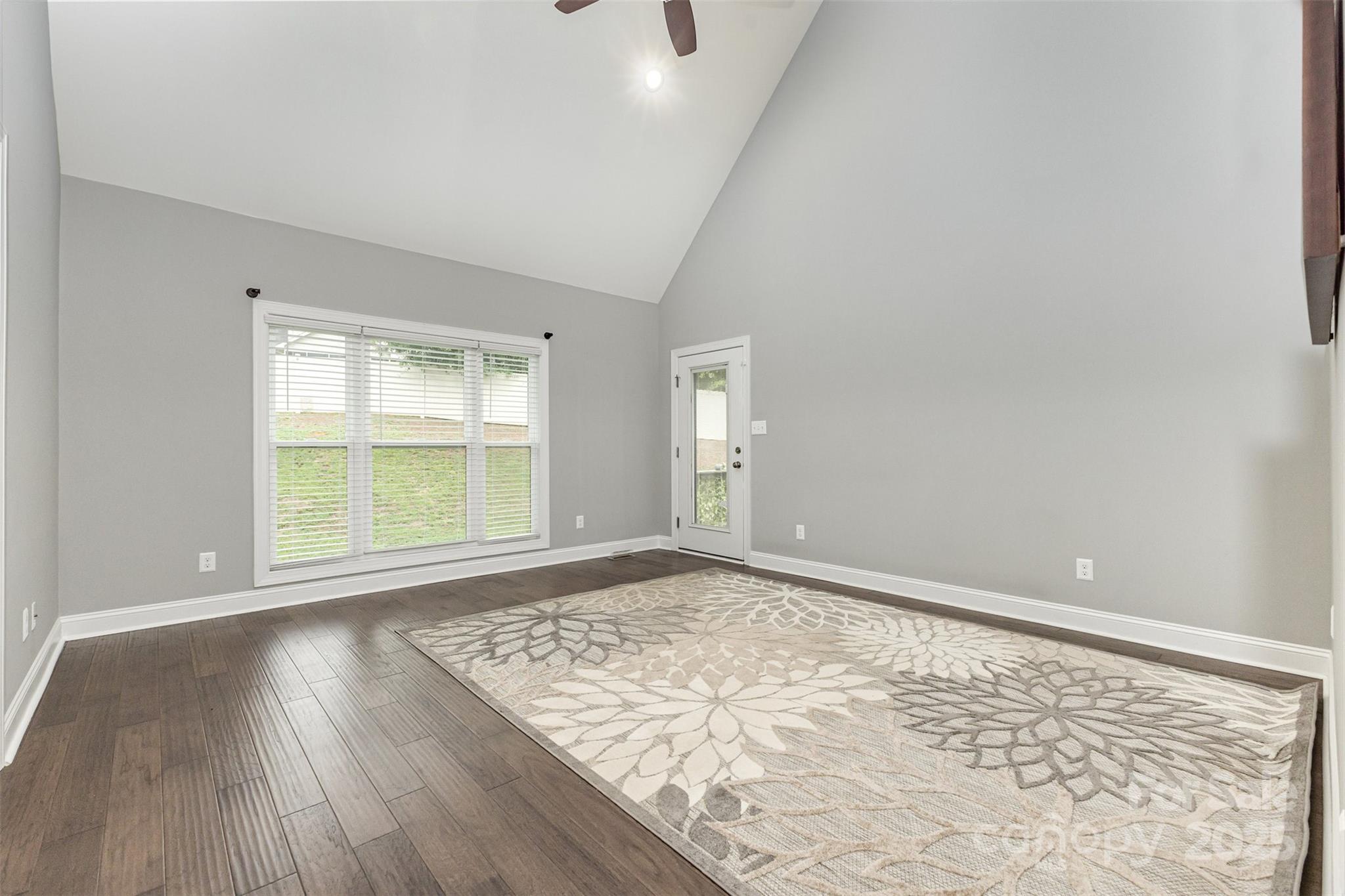 1785 Shamrock Avenue Lancaster, SC 29720 - Photo 11 of 30 an empty room with wooden floor and windows