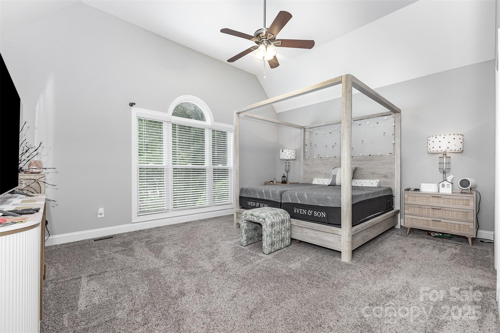 1785 Shamrock Avenue Lancaster, SC 29720 - Photo 15 of 30 a spacious bedroom with a bed and a chandelier