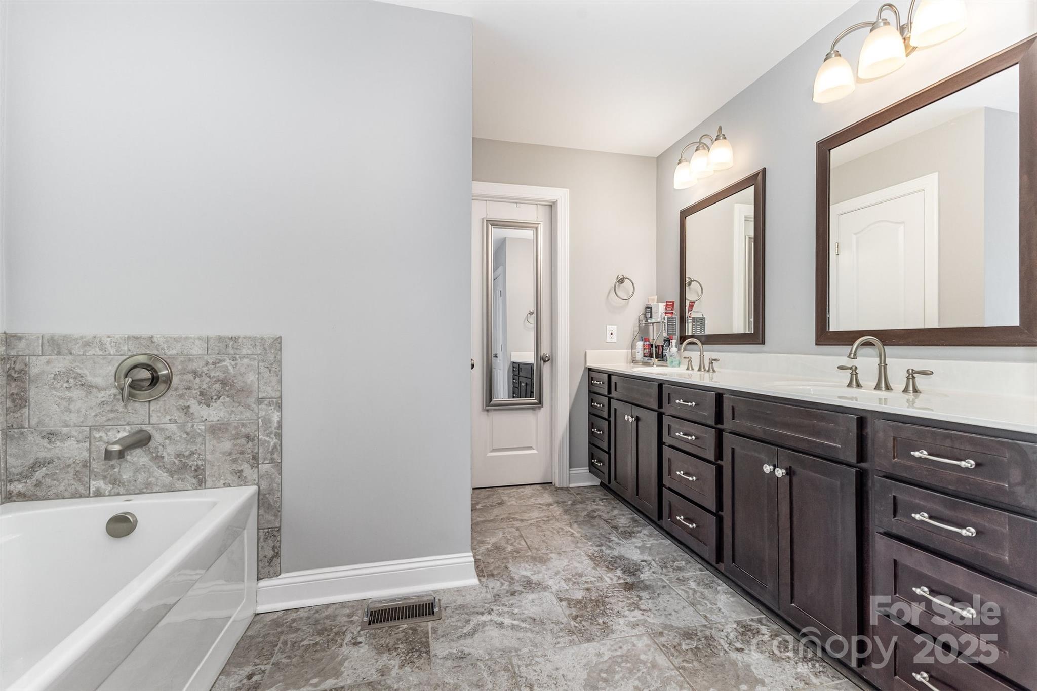 1785 Shamrock Avenue Lancaster, SC 29720 - Photo 17 of 30 a spacious bathroom with a tub sink and mirror