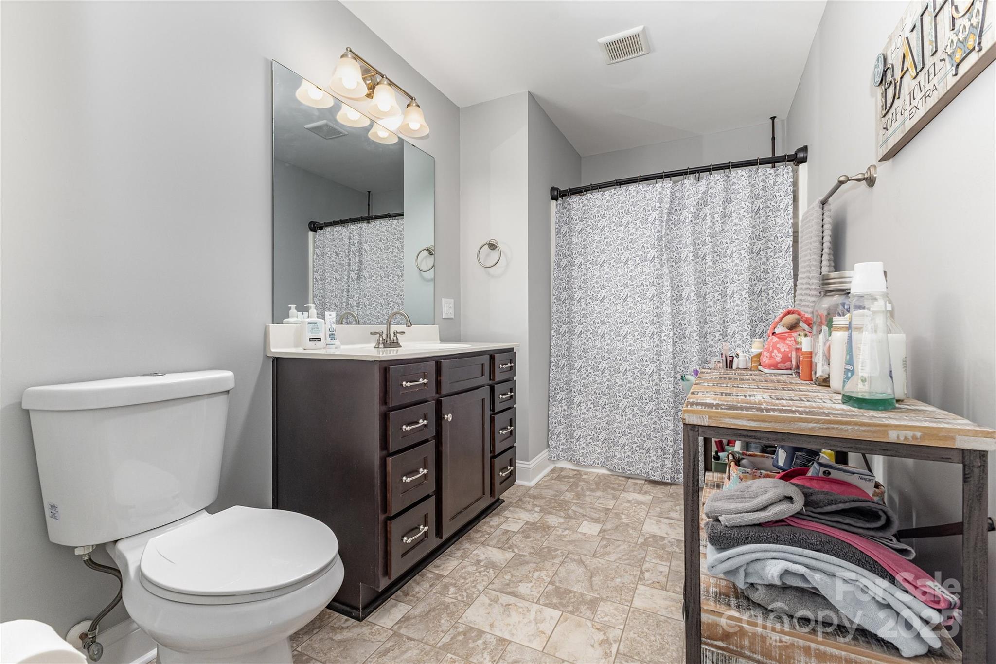 1785 Shamrock Avenue Lancaster, SC 29720 - Photo 22 of 30 a bathroom with a toilet sink and mirror