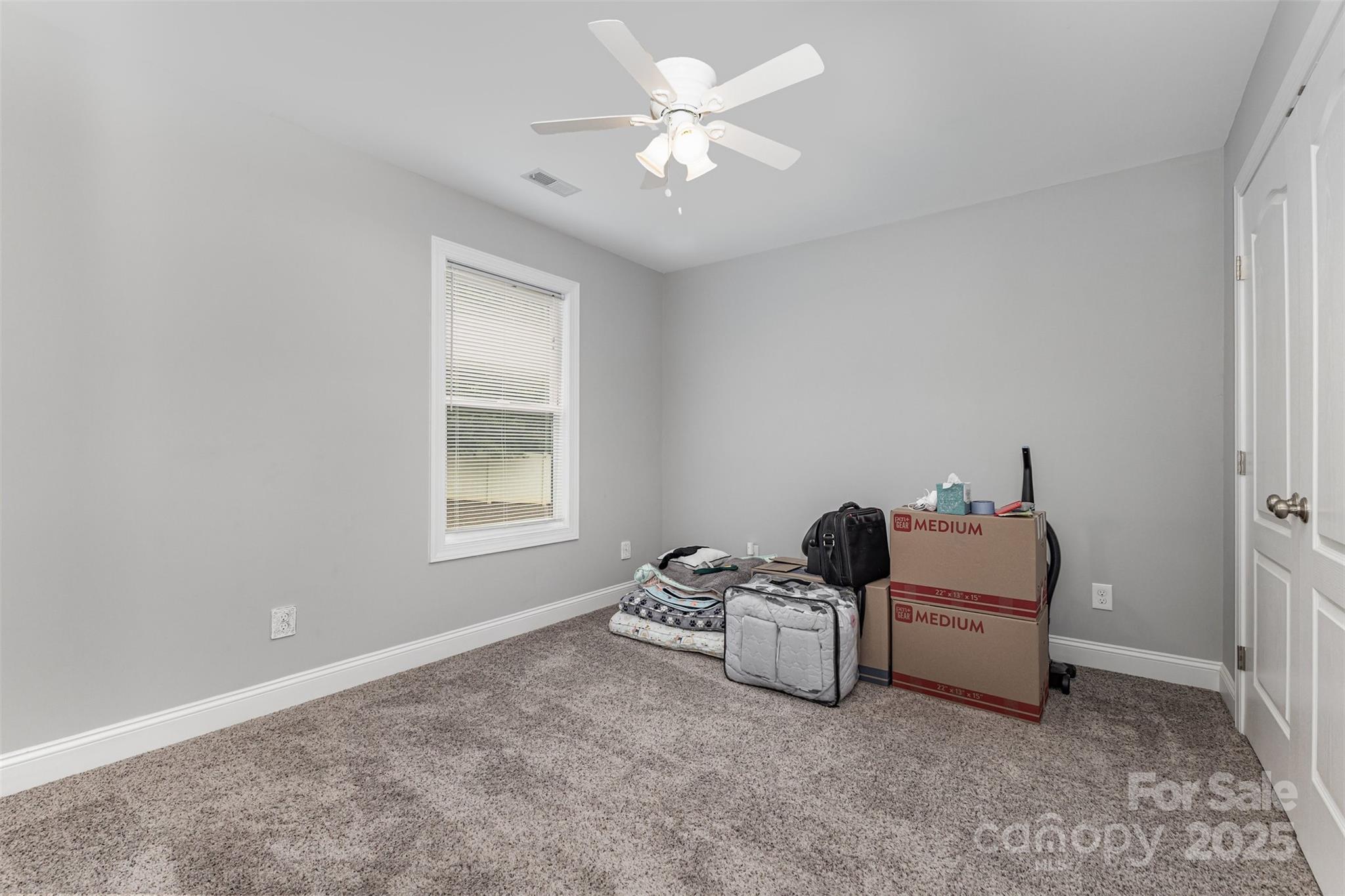 1785 Shamrock Avenue Lancaster, SC 29720 - Photo 23 of 30 a room with a baby bed a chandelier and a window