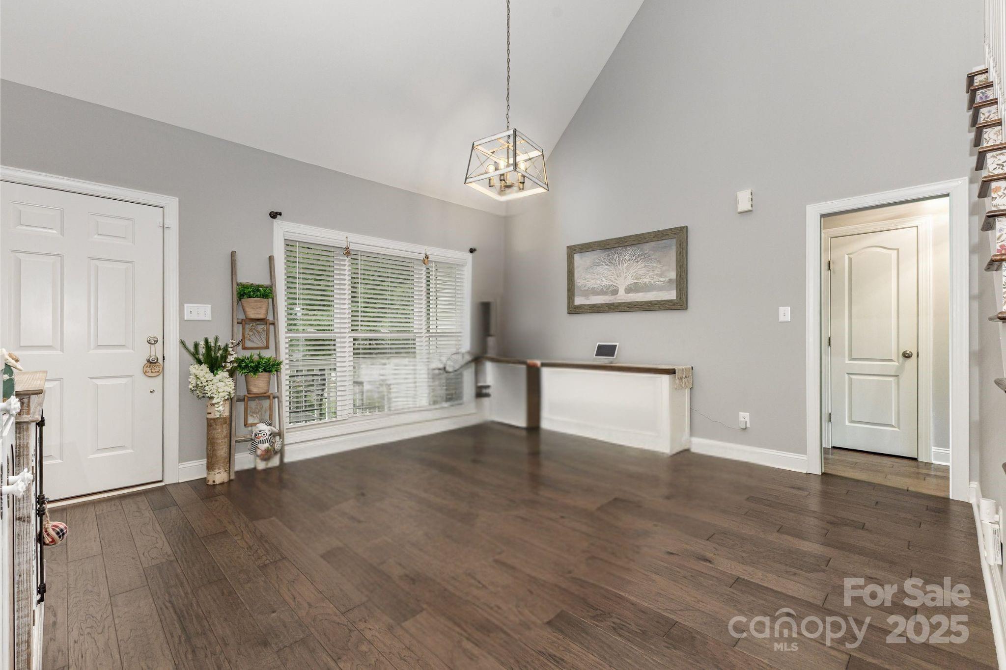 1785 Shamrock Avenue Lancaster, SC 29720 - Photo 4 of 30 a view of an empty room with wooden floor and a window