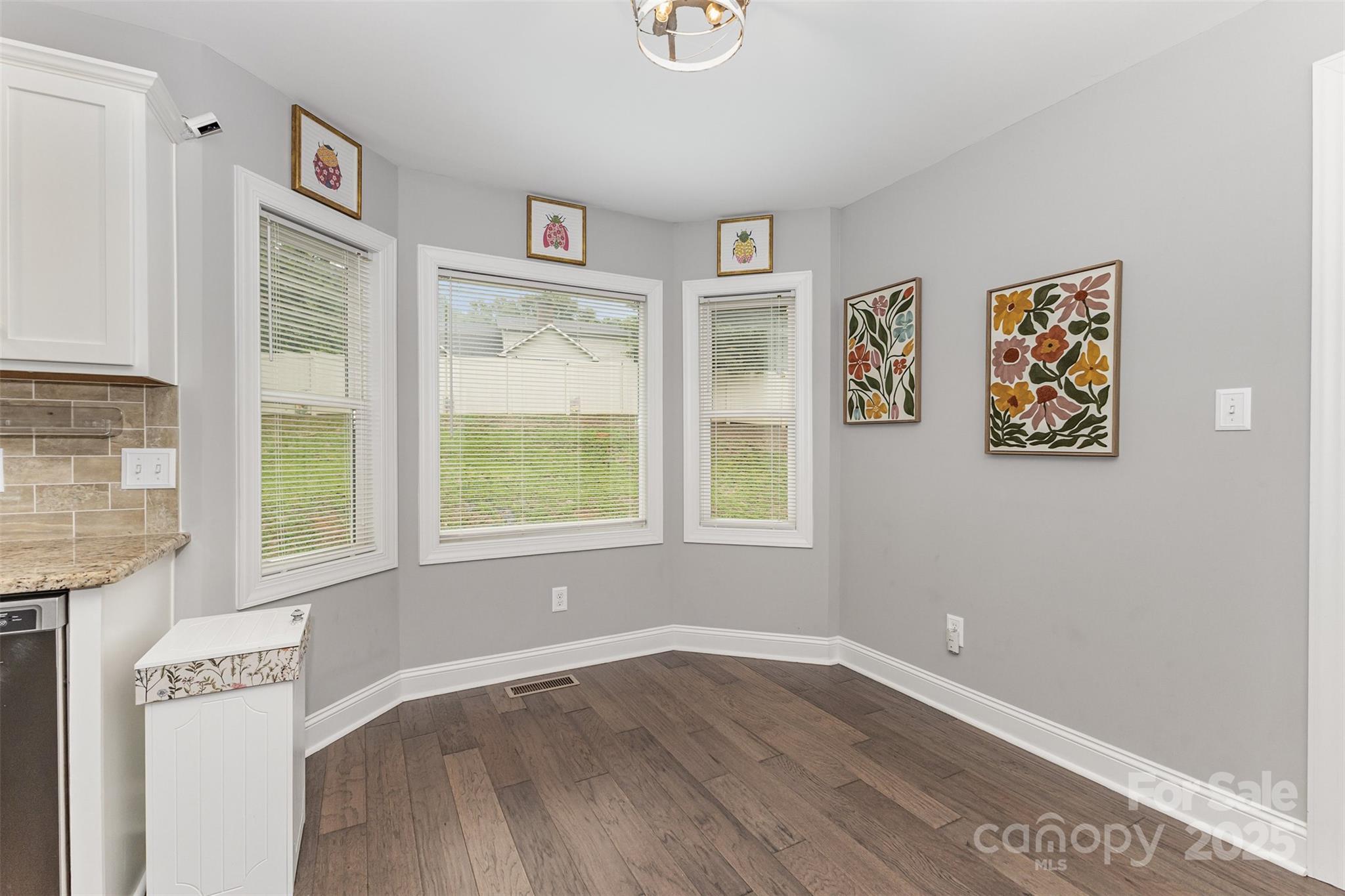 1785 Shamrock Avenue Lancaster, SC 29720 - Photo 9 of 30 wooden floor in an empty room with a window