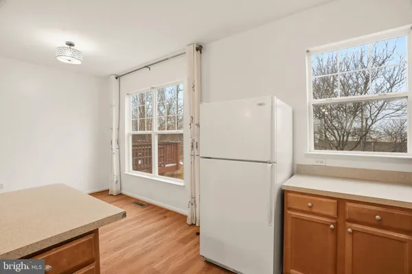 a white refrigerator freezer sitting inside of a kitchen