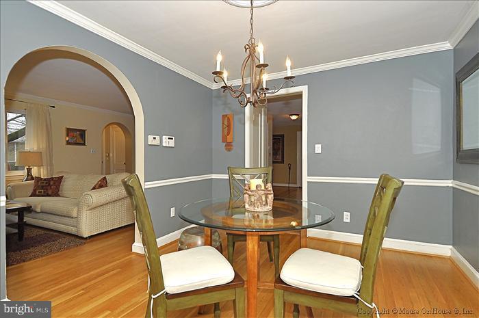 119 Indian Spring Drive Silver Spring, MD 20901 - Photo 1 of 11 a dining room with furniture a chandelier and wooden floor
