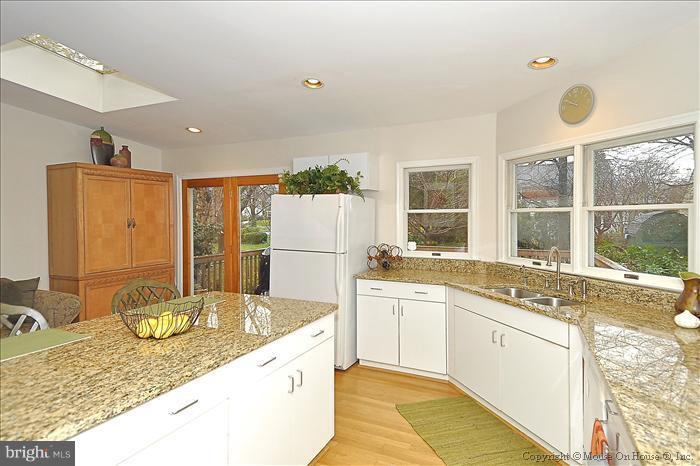119 Indian Spring Drive Silver Spring, MD 20901 - Photo 3 of 11 a kitchen with a sink stove and refrigerator