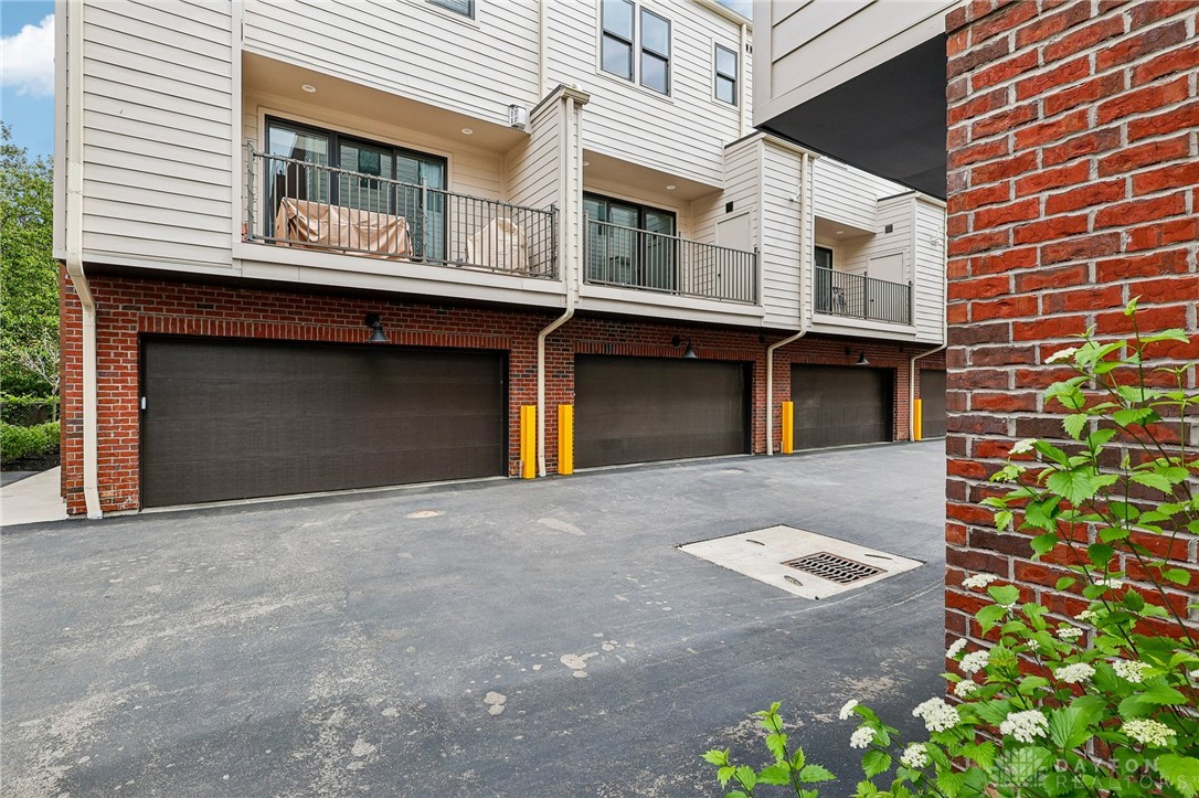 3906 Edwards Road, Unit C Cincinnati, OH 45209 - Photo 43 of 46 This multi-story dwelling features attached garages and private balconies, blending convenience with outdoor enjoyment.
