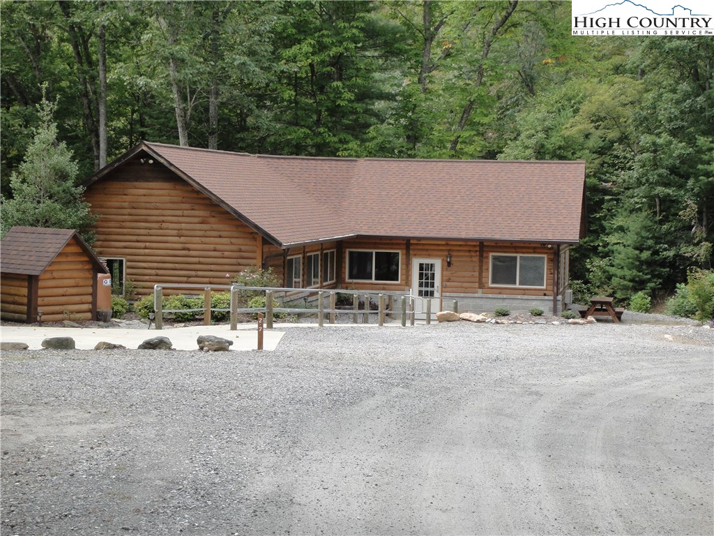 Lot 20 Buck Mountain Road Purlear, NC 28665 - Photo 18 of 21 a front view of a house with a yard