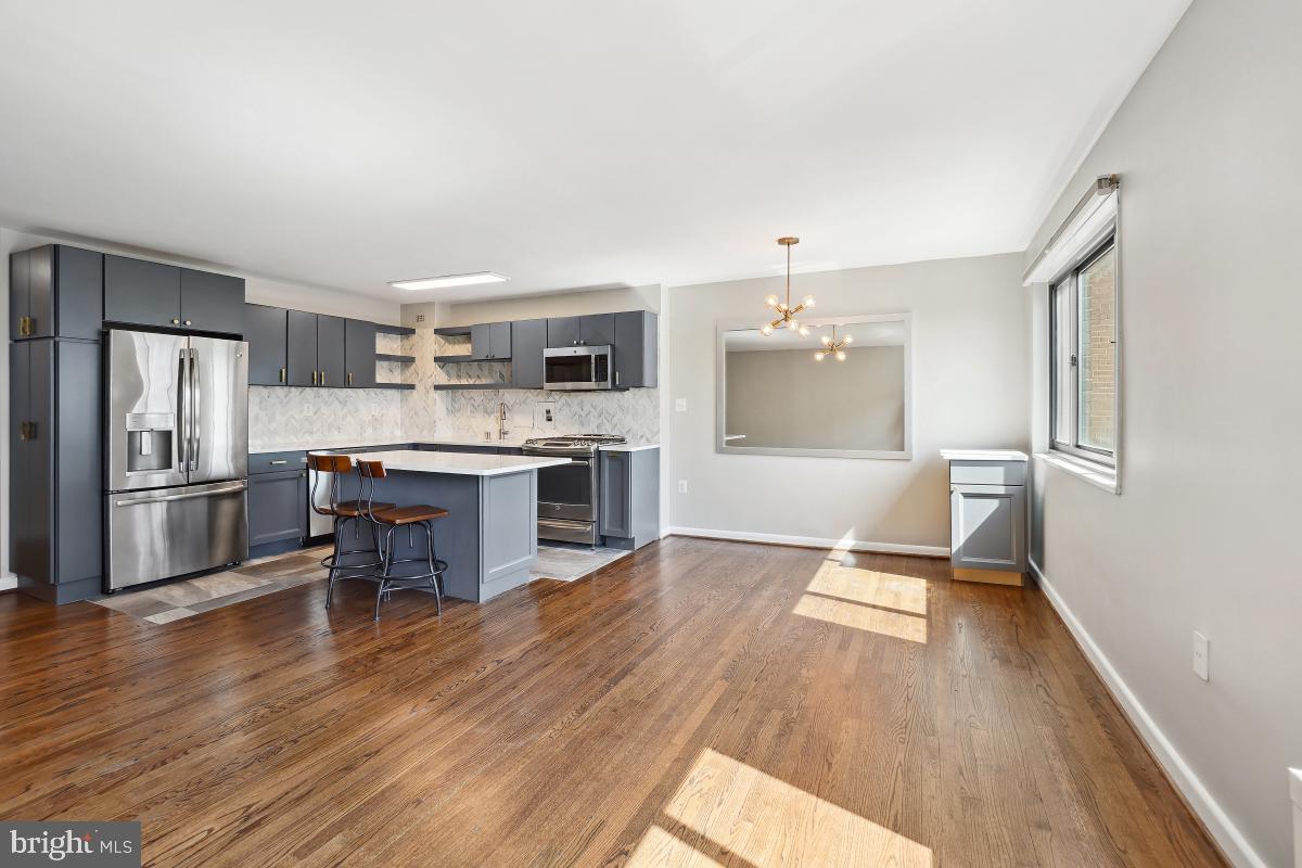 1200 South Arlington Ridge Road, Unit 618 Arlington, VA 22202 - Photo 3 of 17 a kitchen with a refrigerator and a stove top oven