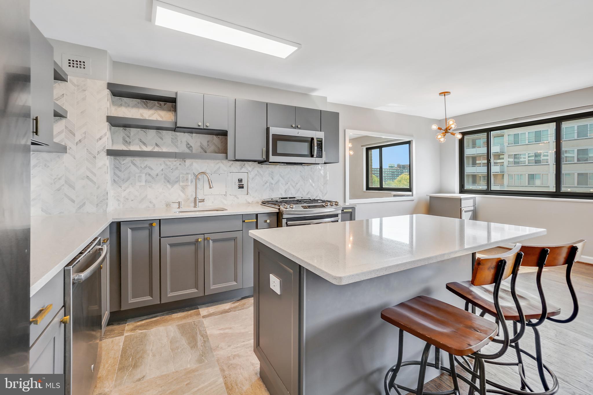 1200 South Arlington Ridge Road, Unit 618 Arlington, VA 22202 - Photo 4 of 17 a kitchen with stainless steel appliances granite countertop a sink stove and refrigerator