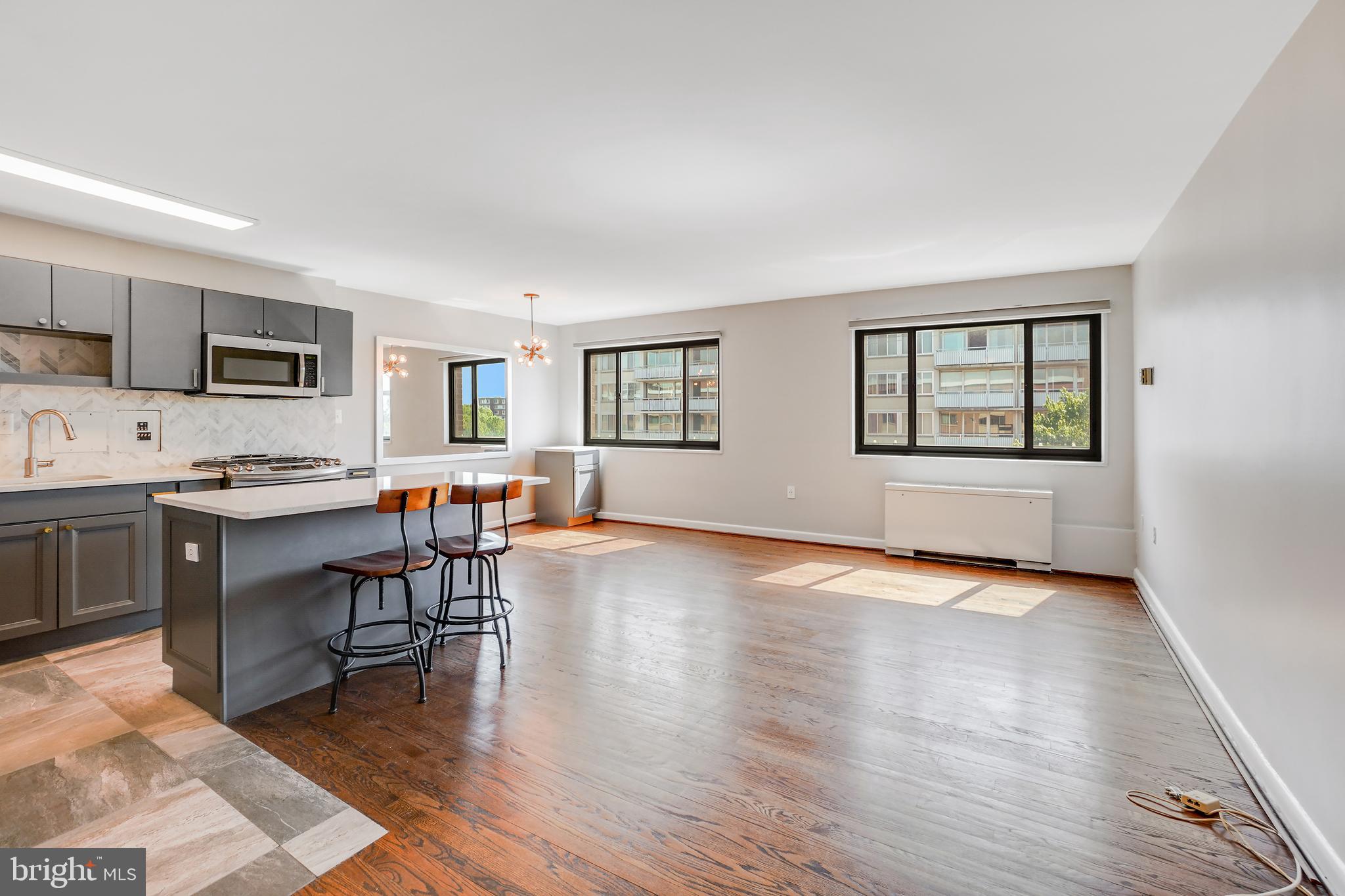 1200 South Arlington Ridge Road, Unit 618 Arlington, VA 22202 - Photo 6 of 17 a open kitchen with cabinets and wooden floor