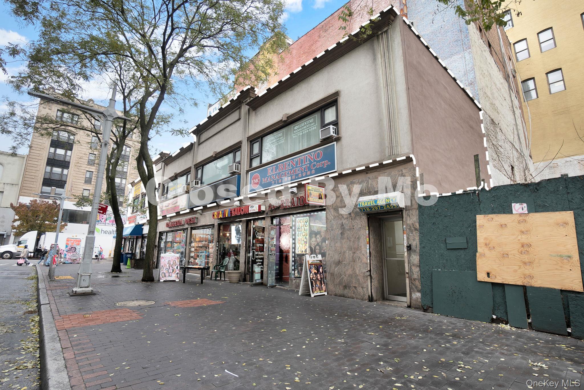 a view of a street with shops