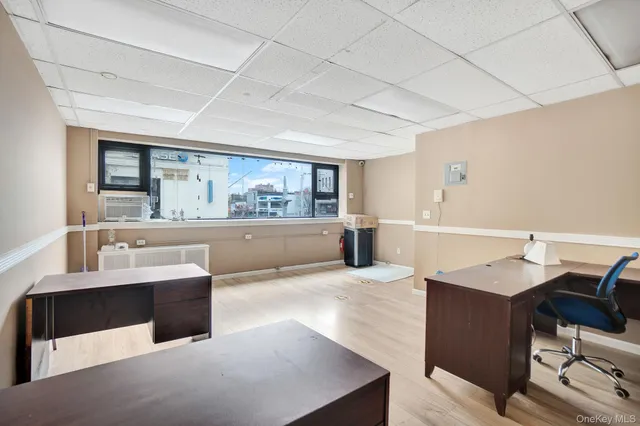 a large living room with stainless steel appliances kitchen island granite countertop furniture and a kitchen view