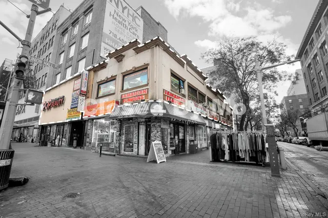 a view of a cafe with sitting area