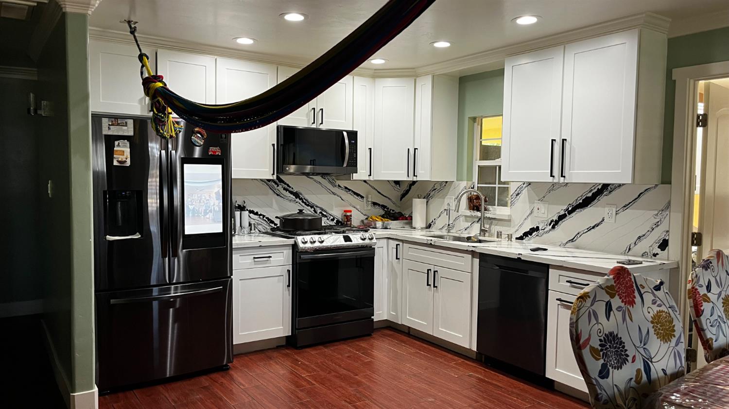 1738 U Street Rio Linda, CA 95673 - Photo 13 of 50 a kitchen with stainless steel appliances granite countertop a stove a refrigerator and a microwave