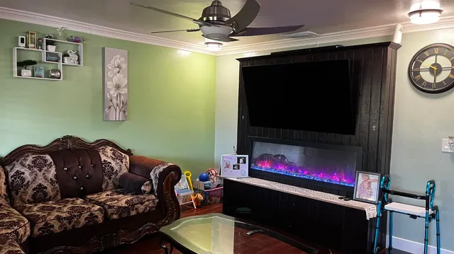 a living room with furniture and a flat screen tv