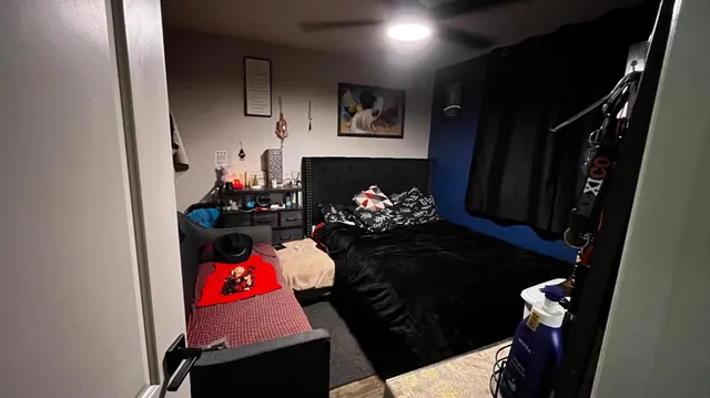 a bathroom with a sink a toilet a mirror and shower