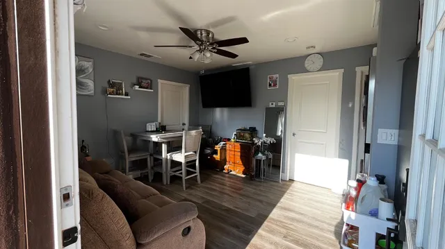 a kitchen with stainless steel appliances granite countertop a refrigerator a stove and a sink