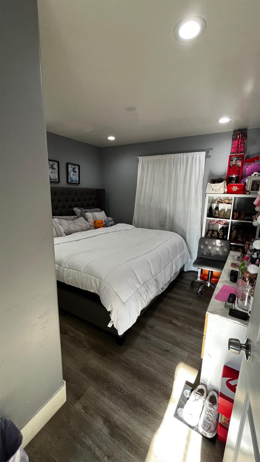 1738 U Street Rio Linda, CA 95673 - Photo 34 of 50 a bedroom with a bed and wooden floor