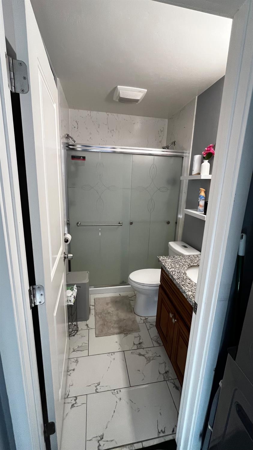 1738 U Street Rio Linda, CA 95673 - Photo 36 of 50 a bathroom with a sink a toilet and a shower