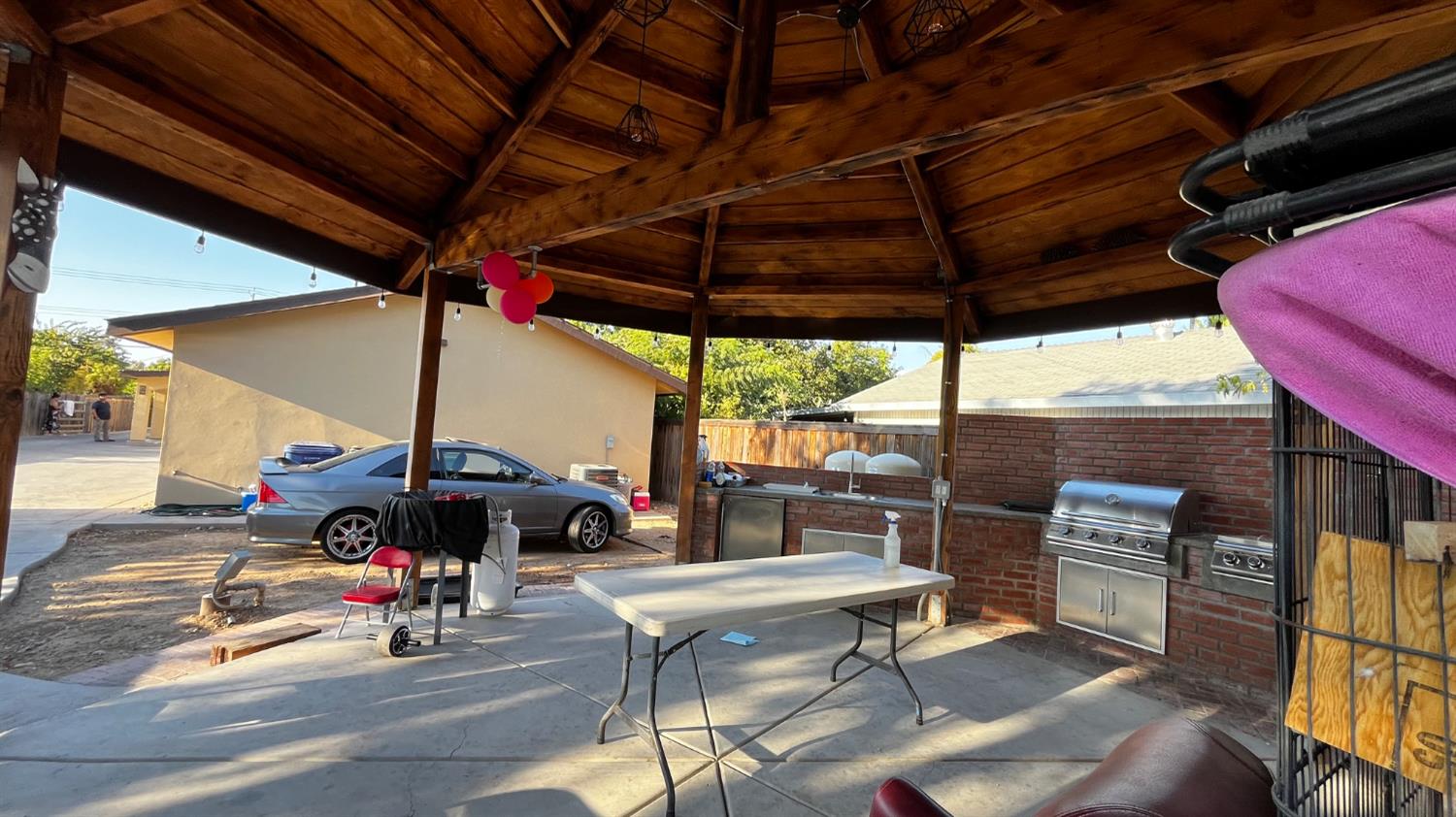 1738 U Street Rio Linda, CA 95673 - Photo 40 of 50 a view of a patio with table and chairs under an umbrella