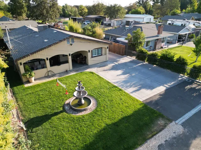 a aerial view of a house with a yard