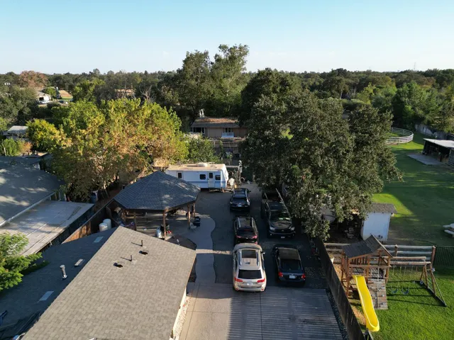an aerial view of a house with a garden