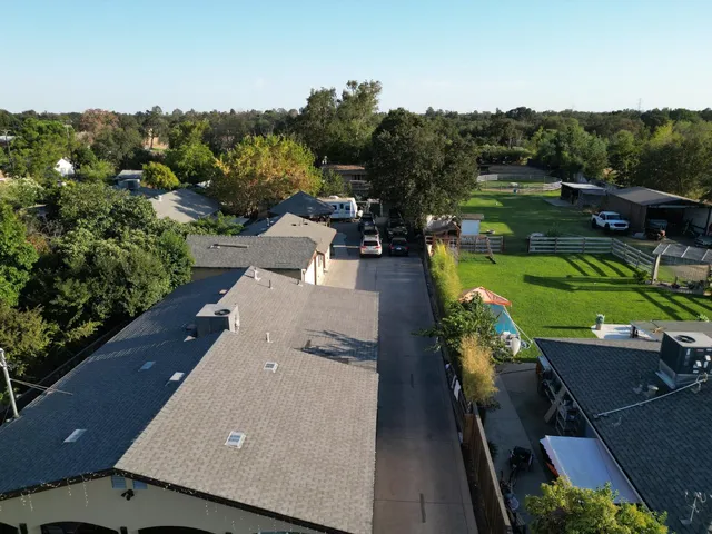 an aerial view of a house with a garden