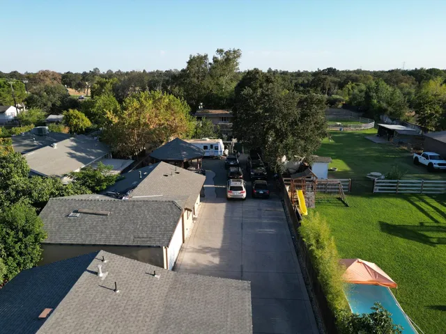 an aerial view of a house with a garden