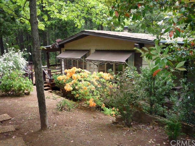 14402 Vine Road Magalia, CA 95954 - Photo 1 of 1 a house with trees in front of it