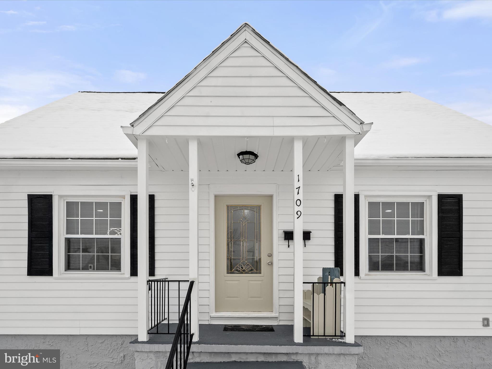 1709 Leslie Road Dundalk, MD 21222 - Photo 1 of 38 a view of a white house with large windows