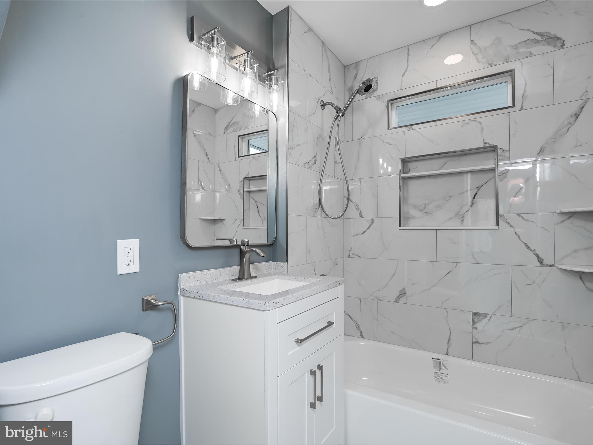 1709 Leslie Road Dundalk, MD 21222 - Photo 20 of 38 a bathroom with a sink a toilet and shower