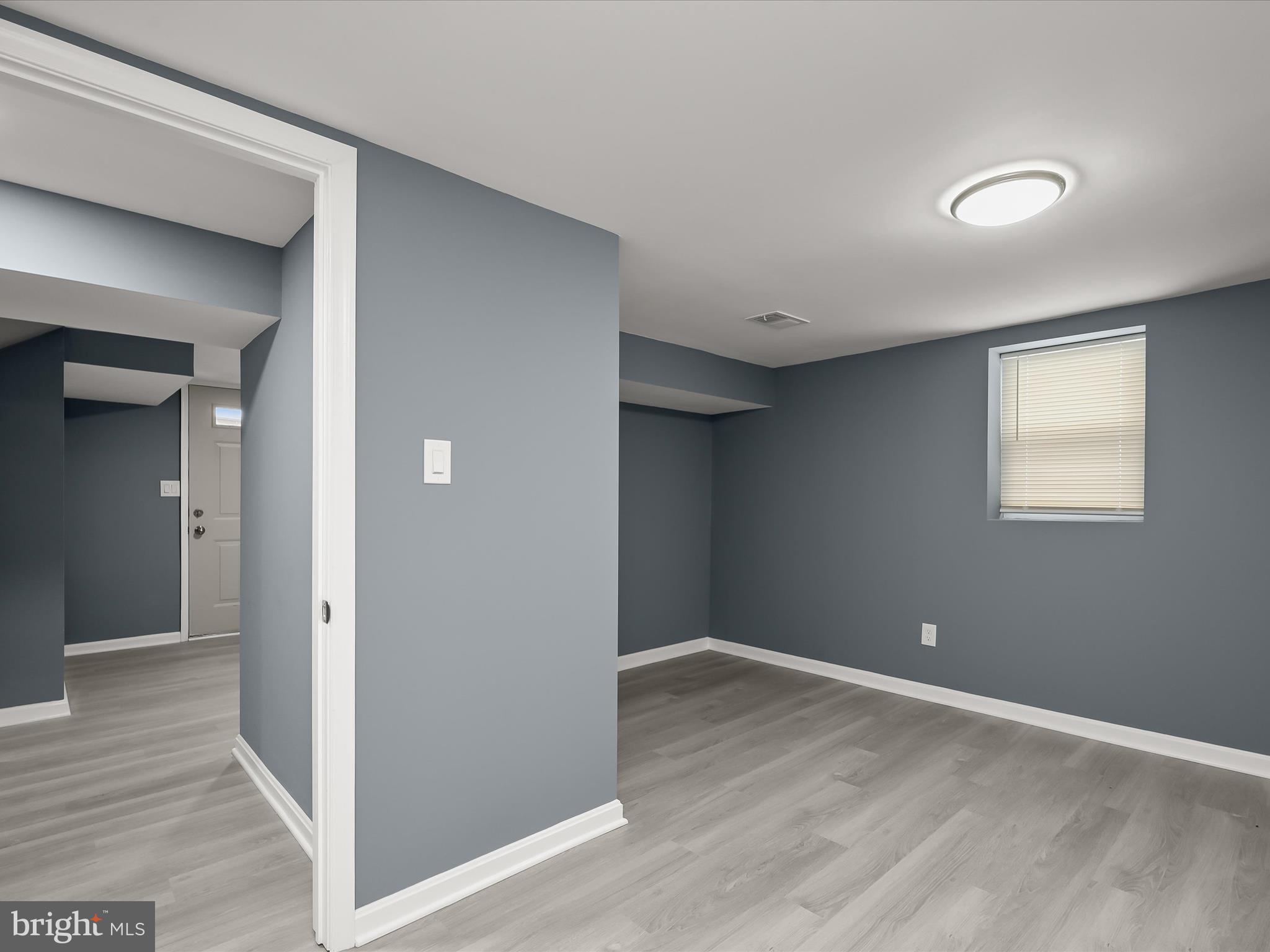 1709 Leslie Road Dundalk, MD 21222 - Photo 27 of 38 a view of an empty room with wooden floor