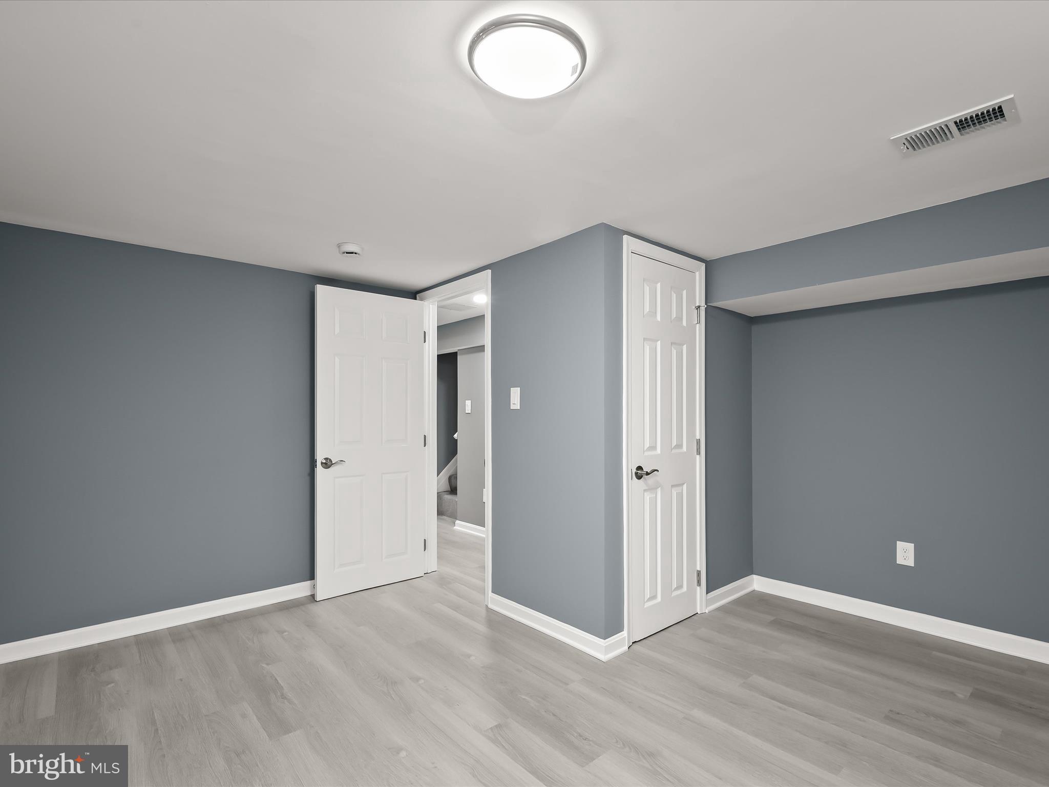 1709 Leslie Road Dundalk, MD 21222 - Photo 28 of 38 a view of an empty room and wooden floor