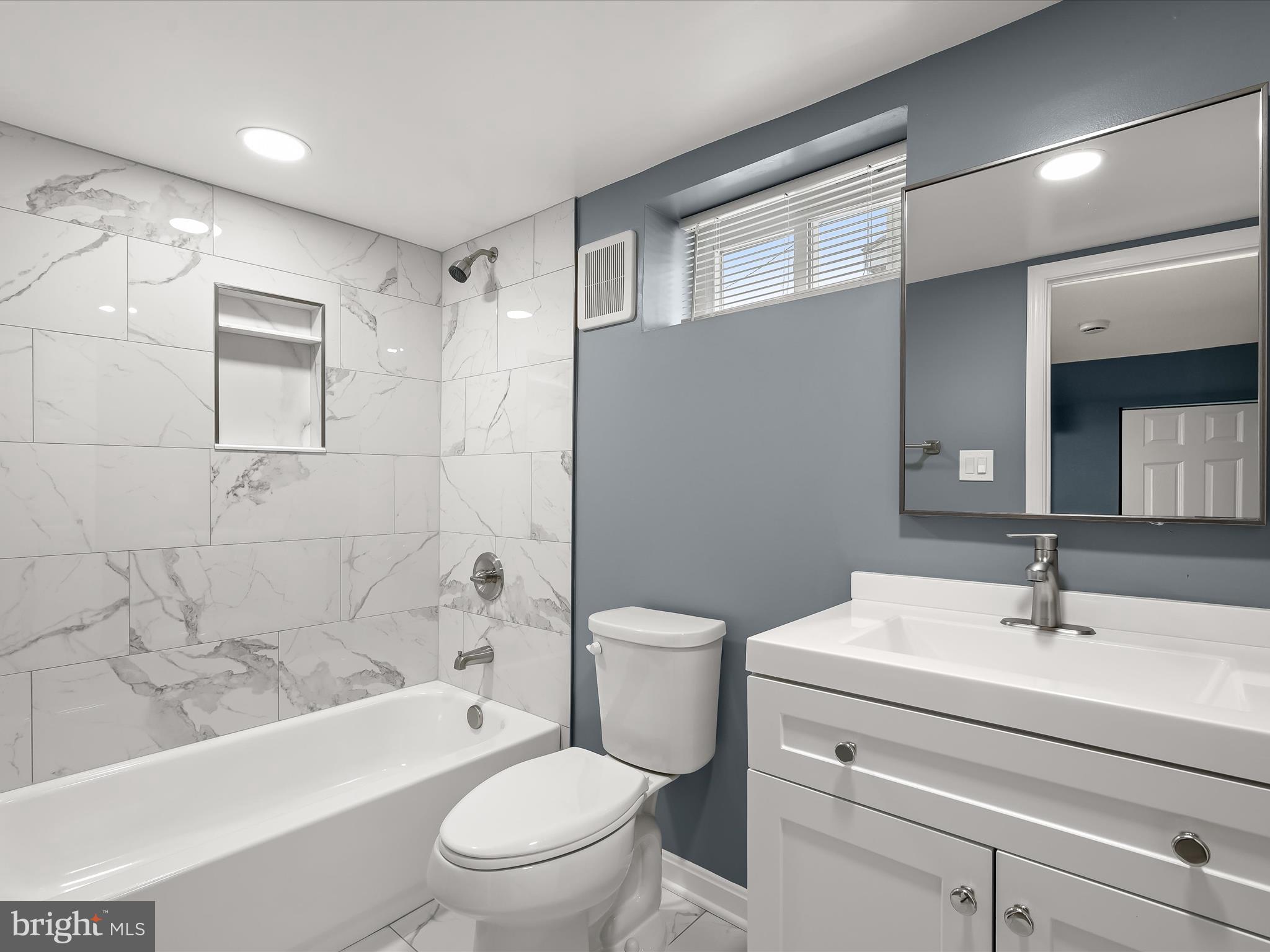 1709 Leslie Road Dundalk, MD 21222 - Photo 31 of 38 a bathroom with a sink a toilet and shower