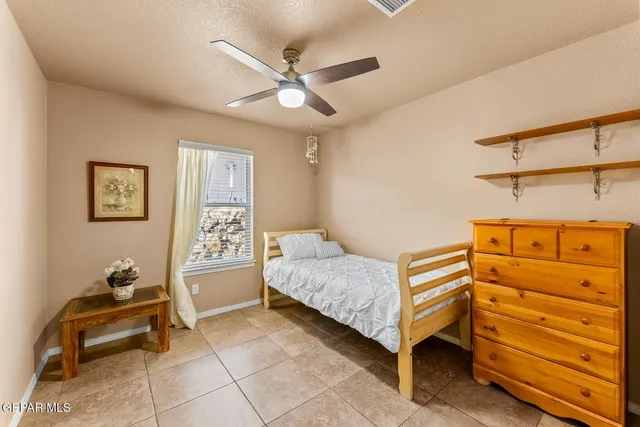 a bedroom with a bed and furniture