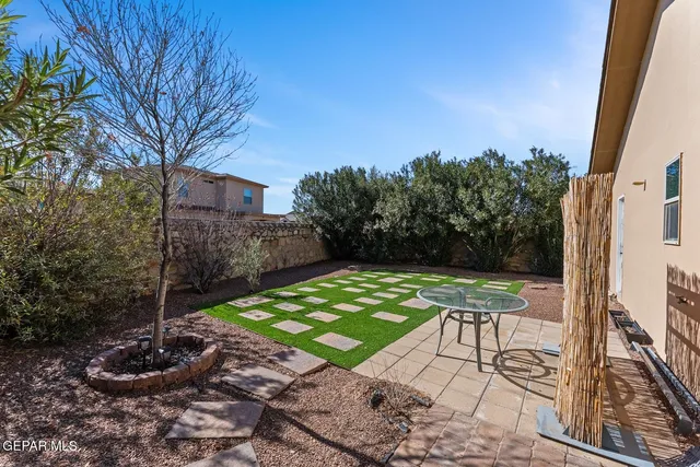 a view of yard with patio