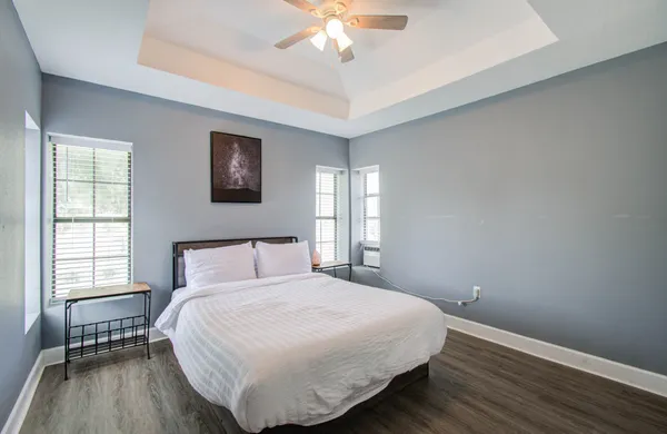 a bedroom with a bed and a window