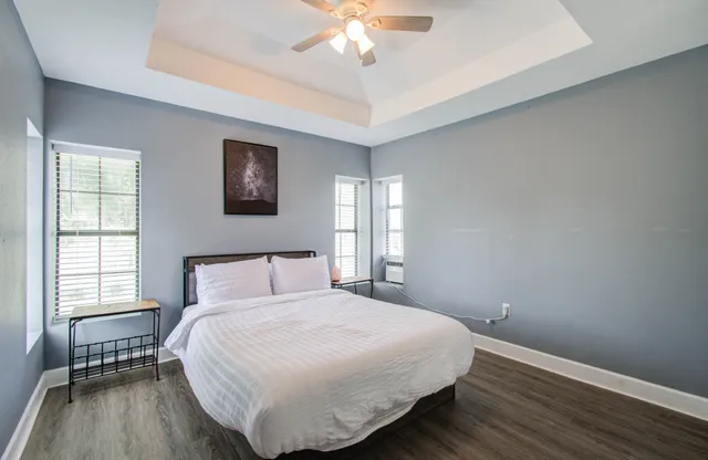 a bedroom with a bed and a window