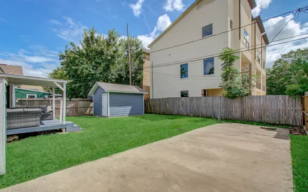 a view of a backyard with plants and a garden