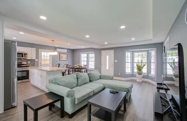 a living room with furniture and a flat screen tv