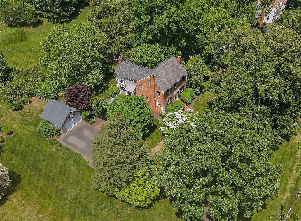 an aerial view of a house with yard outdoor seating and yard