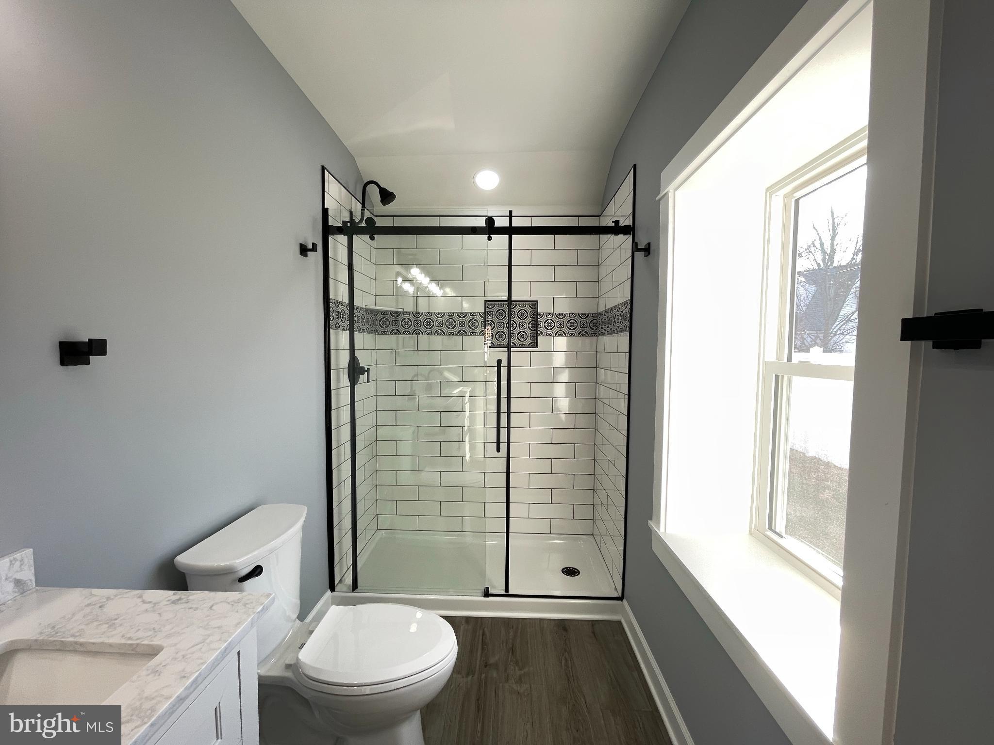 408 Wirt Street Colonial Beach, VA 22443 - Photo 22 of 46 Sleek modern bathroom with elegant finishes.