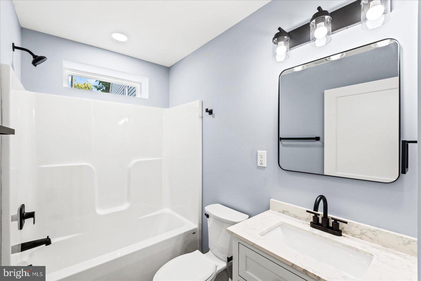 408 Wirt Street Colonial Beach, VA 22443 - Photo 28 of 46 Modern bathroom with sleek finishes.