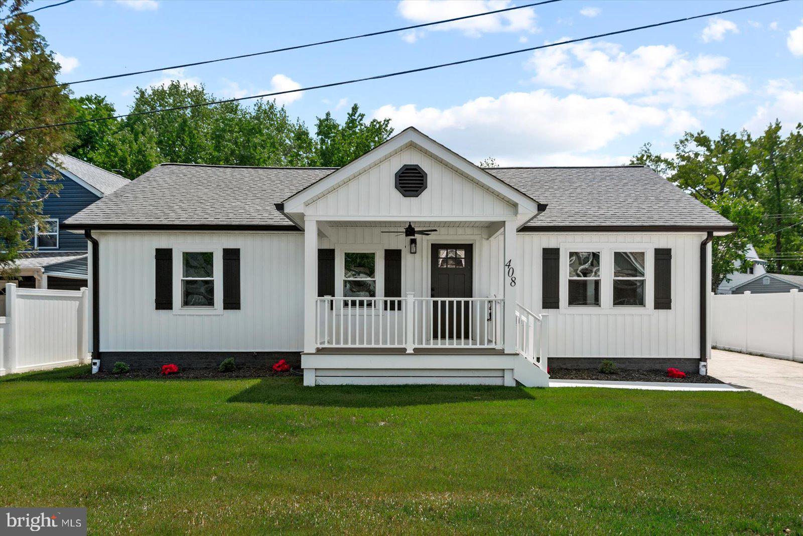 408 Wirt Street Colonial Beach, VA 22443 - Photo 44 of 46 Charming white cottage with lush lawn.