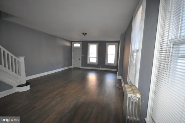 a view of gallery with wooden floor